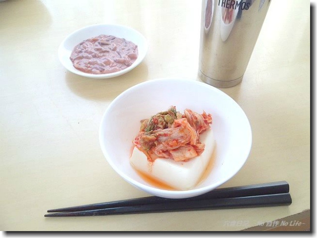 白菜を担ぐヒト。